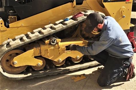 how tight should mini excavator tracks be|caterpillar mini track tension.